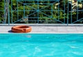 A life buoy for safety on the edge of pool