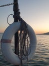 Life buoy and sea sunset Royalty Free Stock Photo