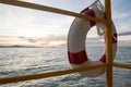 Life buoy and sea sunset Royalty Free Stock Photo