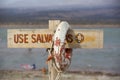 Life buoy and sign dangerous to swim, Lake of Wind, Argentina Royalty Free Stock Photo