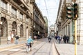 The daily life of the city of Milan. Numerous passers-by and tourists are walking along the Via Tommaso Grossi street in Milan,