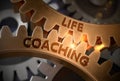 Life Coaching on Golden Metallic Cogwheels. 3D Illustration. Royalty Free Stock Photo