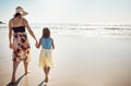 Life couldnt get any more perfect. Rear view shot of a mother and her little daughter bonding together at the beach. Royalty Free Stock Photo