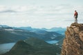 Life on the edge Traveler on cliff mountains