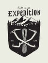 Life is Expedition - crossed ice axes and rope in front of the montein range and woods Royalty Free Stock Photo