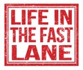 LIFE IN THE FAST LANE, text on red grungy stamp sign Royalty Free Stock Photo