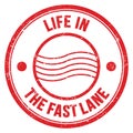 LIFE IN THE FAST LANE text on red round postal stamp sign Royalty Free Stock Photo