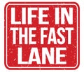 LIFE IN THE FAST LANE, text written on red stamp sign Royalty Free Stock Photo