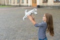 Life full of fun. Happy kid play with toy dog outdoors. Enjoying playtime. Play and fun. Childhood fun. Leisure and free