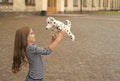 Life full of fun. Happy kid play with toy dog outdoors. Enjoying playtime. Play and fun. Childhood fun. Leisure and free