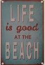Life is good at the beach. weathered retro style sign