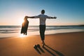 Life is good. Man with open arms enjoying life and freedom on the beach with sunset Royalty Free Stock Photo