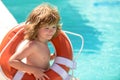 Life guard kid. Be careful on water. Saving life. Helping concept. Child with rescue circle. Royalty Free Stock Photo