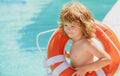 Life guard kid. Be careful on water. Saving life. Helping concept. Child with rescue circle. Royalty Free Stock Photo