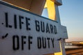 Life guard off duty sign on beach Royalty Free Stock Photo