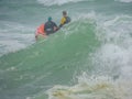 Life guards on heaving ocean Royalty Free Stock Photo