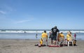 Life guards watch swimmers safety.