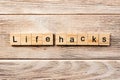 Life hacks word written on wood block. life hacks text on table, concept Royalty Free Stock Photo