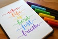 WHEN LIFE IS HARD JUST BREATHE hand-lettered in notebook Royalty Free Stock Photo