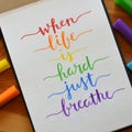 WHEN LIFE IS HARD JUST BREATHE hand-lettered in notebook