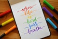 WHEN LIFE IS HARD JUST BREATHE hand-lettered in notebook Royalty Free Stock Photo