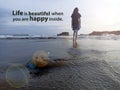 Life inspirational motivational quote - Life is beautiful when you are happy inside. With a girl walking on beach from behind.