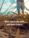 Life inspirational motivational quote - Don\'t regret the past, just learn from it. With dry grass and man feet standing. Royalty Free Stock Photo