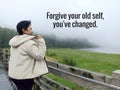 Life inspirational motivational quote - Forgive your old self, you've changed. A woman standing on wooden bridge. Royalty Free Stock Photo