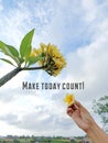 Life inspirational motivational quote - Make today count. With person picking a Bali frangipani flower on the tree. Royalty Free Stock Photo