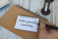 Life inspirational quote text on notepad - Make yourself a priority. Life Inspirational concept Royalty Free Stock Photo