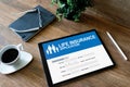 Life insurance online application form on device screen. Royalty Free Stock Photo