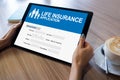 Life insurance online application form on device screen. Royalty Free Stock Photo