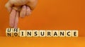 Life insurance symbol. Businessman turns cubes and changes concept words No insurance to Life insurance. Beautiful orange table