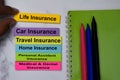 Life Insurance text on sticky notes with keywords isolated on office desk