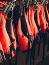 Life jacket on rail for costumer, Red Life jacket with black belts, Personal flotation device. Life jacket ready to be Royalty Free Stock Photo
