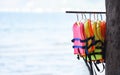 Life jacket safety equipment hang clothes line in the sea background Royalty Free Stock Photo