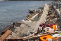 Life Jackets discarded and sunken Turkish boat in the port. Many refugees come from Turkey in an boats. Royalty Free Stock Photo