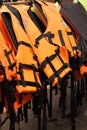 Life jackets hanging on the row. Royalty Free Stock Photo