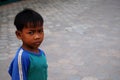 Life and lifestyle of Cambodian boy children kid people posing portrait for take photo with foreign traveler travel visit in Royalty Free Stock Photo