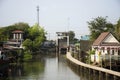 Life lifestyle of thai people at chaopraya riverside and water drainage door in fishing village for travelers visit at Sam Khok Royalty Free Stock Photo