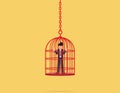 Life limitation.businessman standing closed in a birdcage.