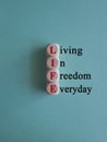 LIFE living in freedom everyday symbol. Concept red words LIFE living in freedom everyday Royalty Free Stock Photo