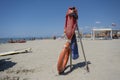 Life preserver on sandy beach somewhere in Italy Royalty Free Stock Photo