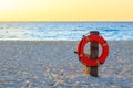 Life preserver on sandy beach