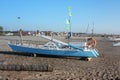 A life raft. a boat stranded or parked on the sandy beach in broad daylight