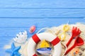 Life ring and beach toys on blue Royalty Free Stock Photo