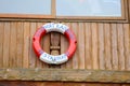 Life Ring Hanging on Coastal House Balcony Nautical Decor Royalty Free Stock Photo