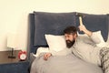 Life routine. Healthy sleep concept. bearded man hipster want to sleep. hate noise of alarm clock. Irritated guy destroy