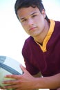 The life of a rugby player. Cropped portrait of a young rugby player holding a ball. Royalty Free Stock Photo