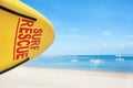 Life saving yellow board with surf rescue sign on beach Royalty Free Stock Photo